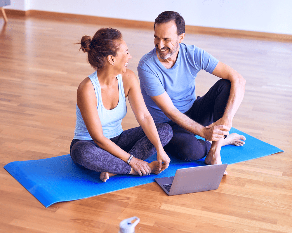 woman and man on yoga mat